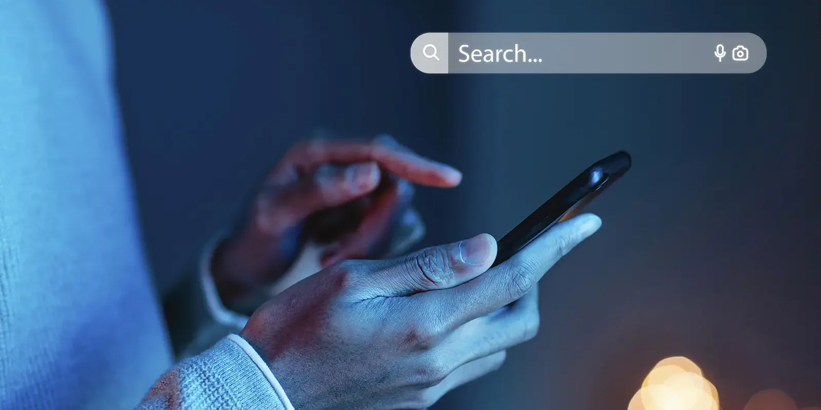 How to appear in ChatGPT, Gemini and Perplexity Person typing a question into a search bar on a smartphone